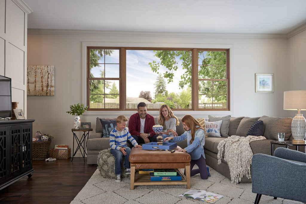 Family sitting on a couch playing a game