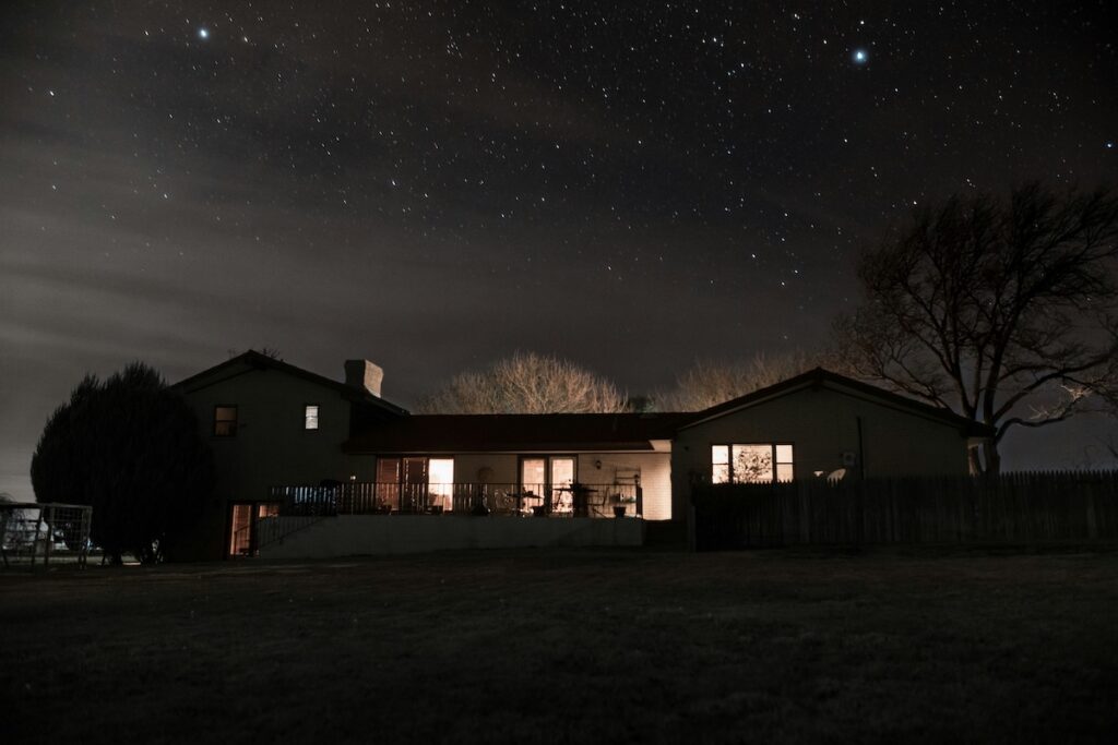 A ranch house at night