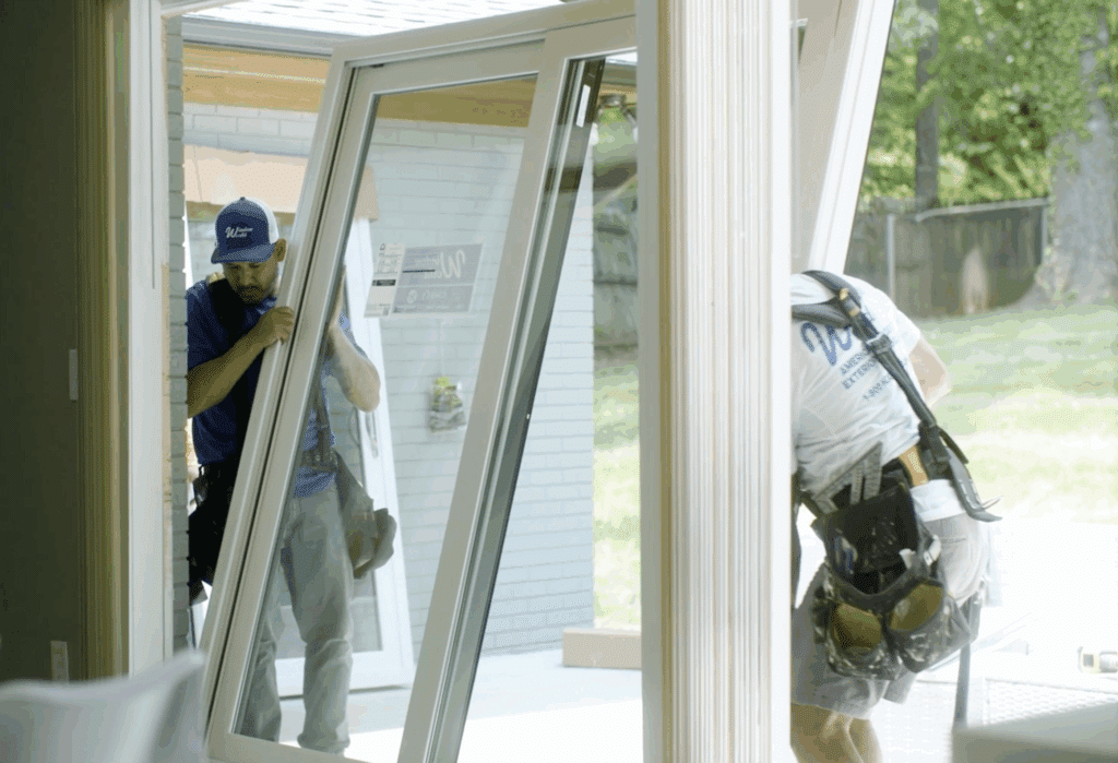 Window World installers installing a patio door